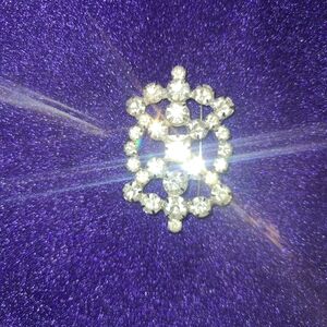 Vintage Silver Starburst Brooch with Dazzling Crystals